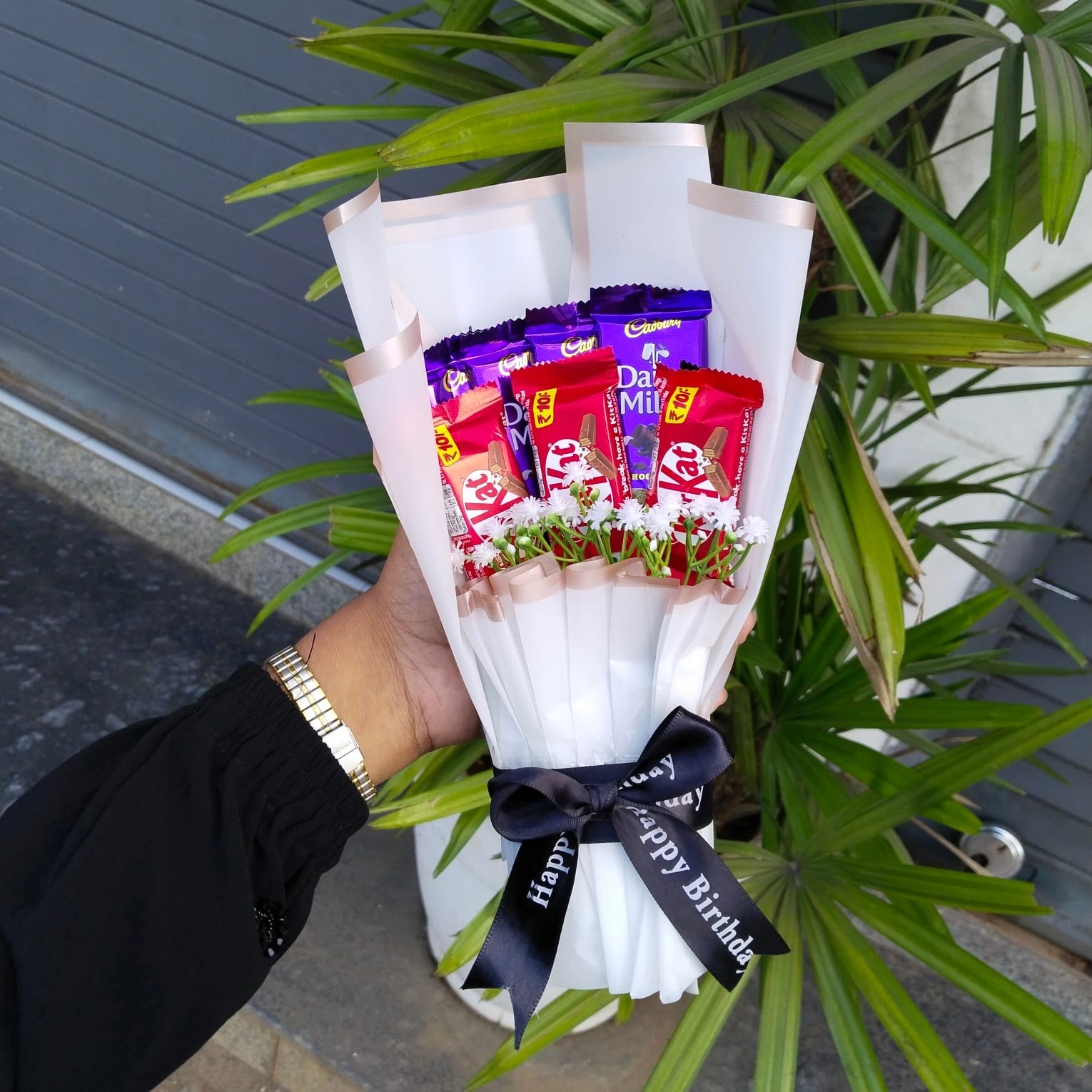 it is a chocolate and flower mini bouquet